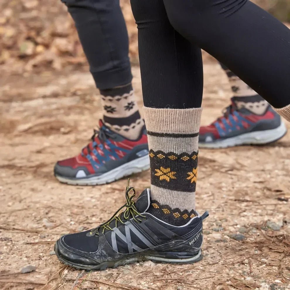 Wool hiking socks worn with walking shoes on an outdoor trail