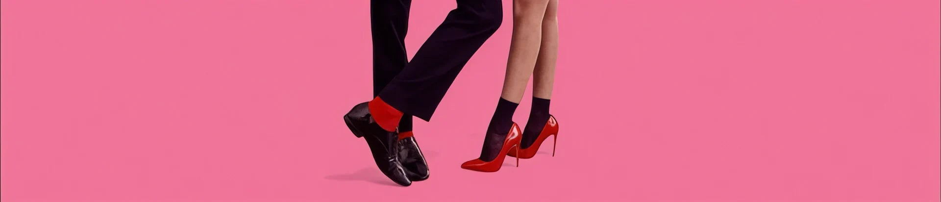 image of a man and woman in dress socks against a pink background