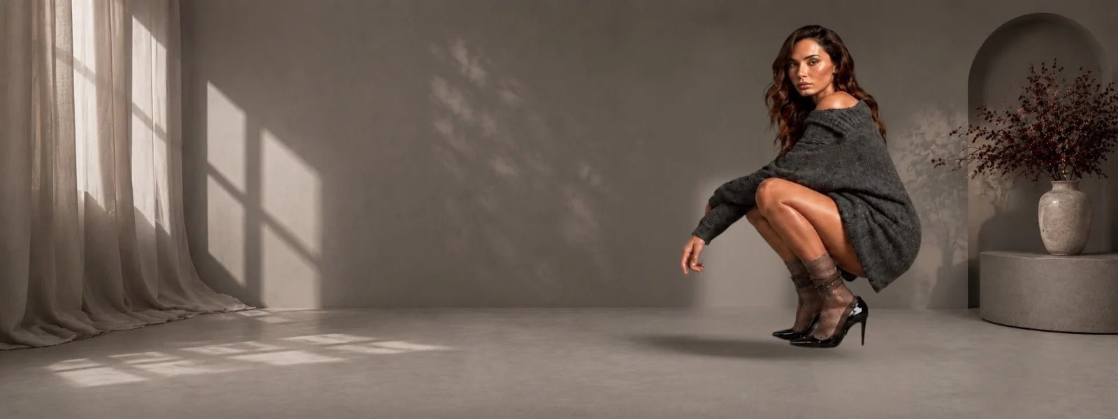 Luxury women’s sheer ankle socks styled with black heels in an editorial fashion studio.