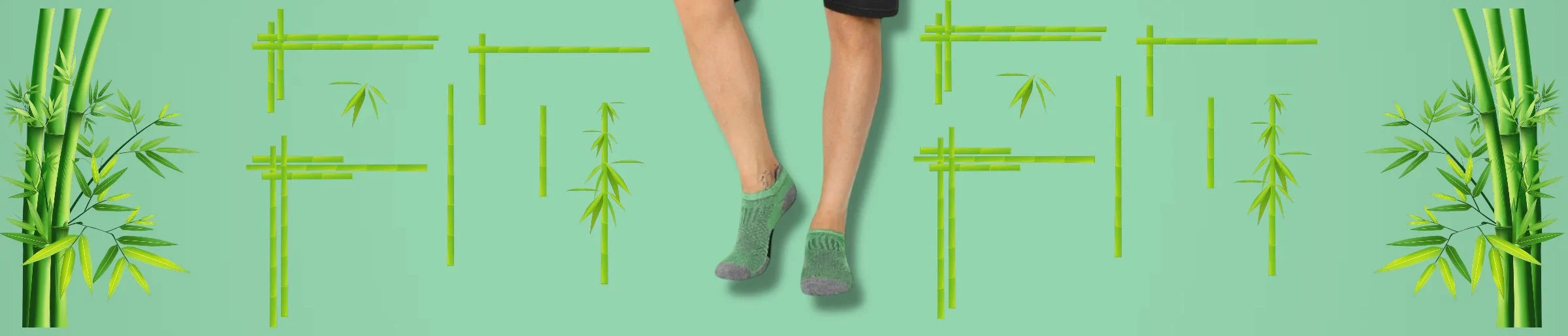 A man wearing green sneaker socks against a green background with bamboo design