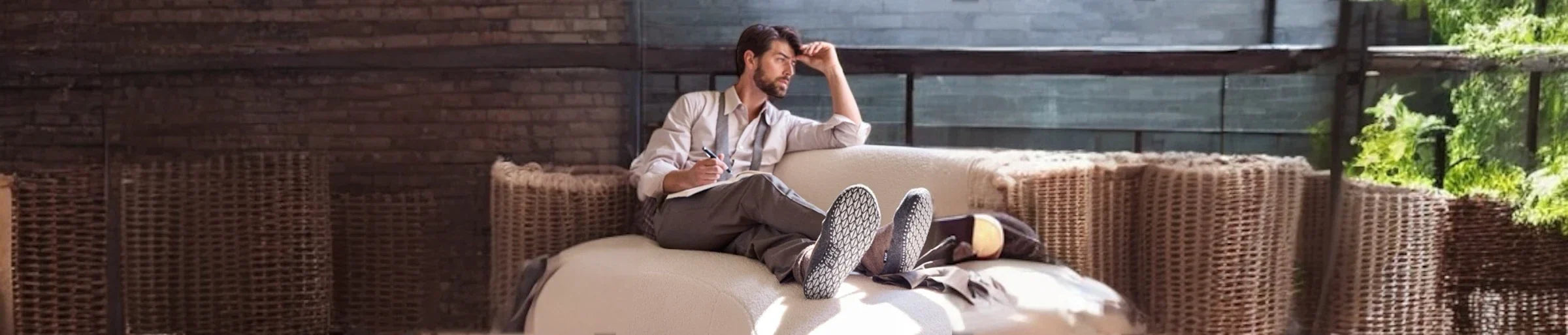 Man sitting on a lounge in a living room wearing socks