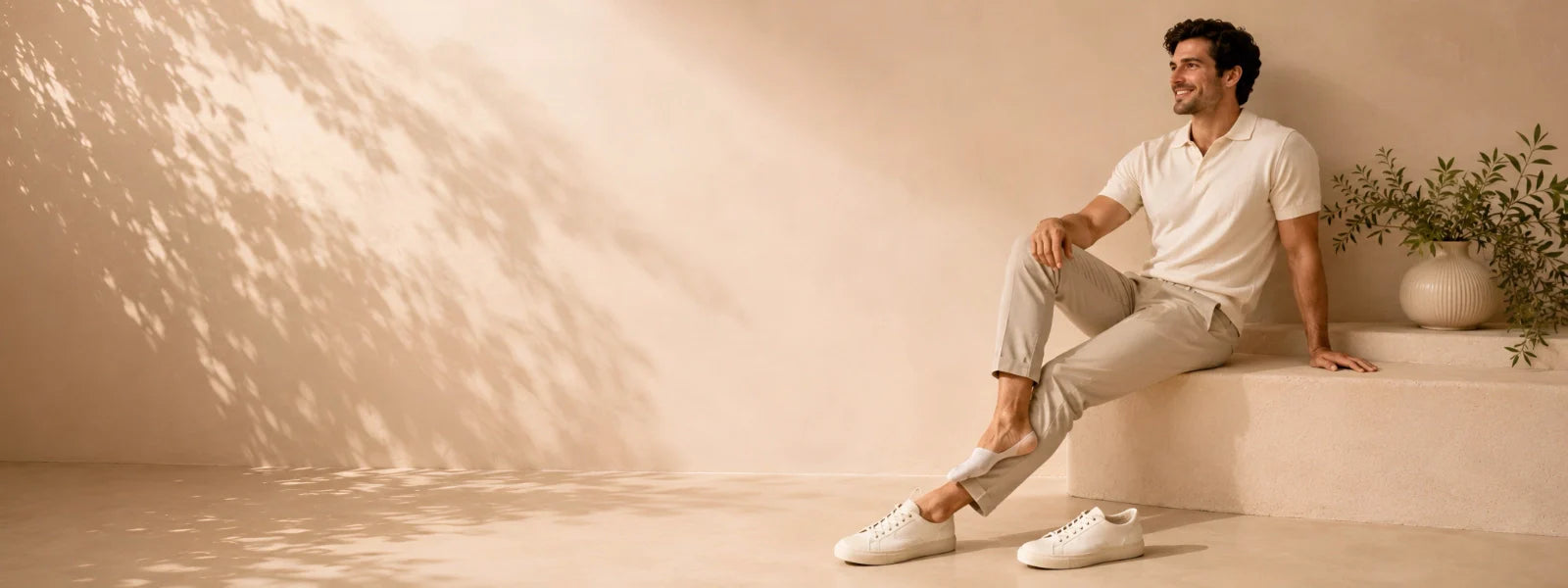 Man wearing white no show socks with sneakers in a premium lifestyle setting | Uniq Socks Australia