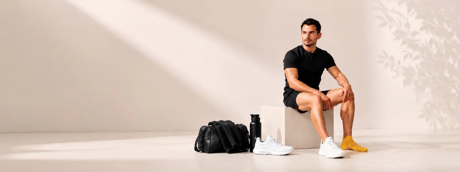 Man wearing yellow sport socks in a premium fitness lifestyle setting | Uniq Socks Australia