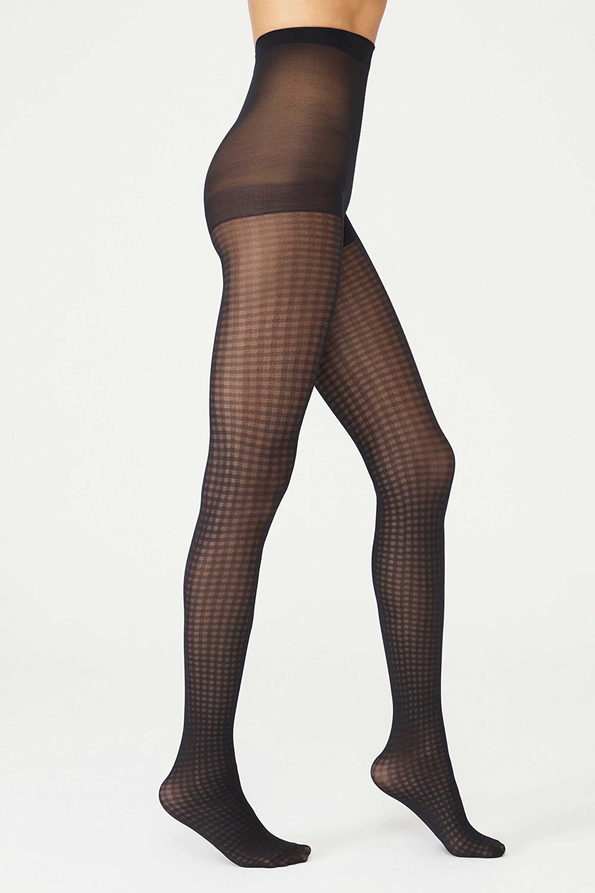 image of woman wearing black gingham patterned pantyhose