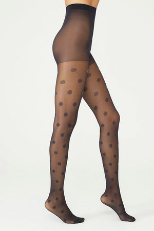 image of woman wearing olive green with dots patterned pantyhose