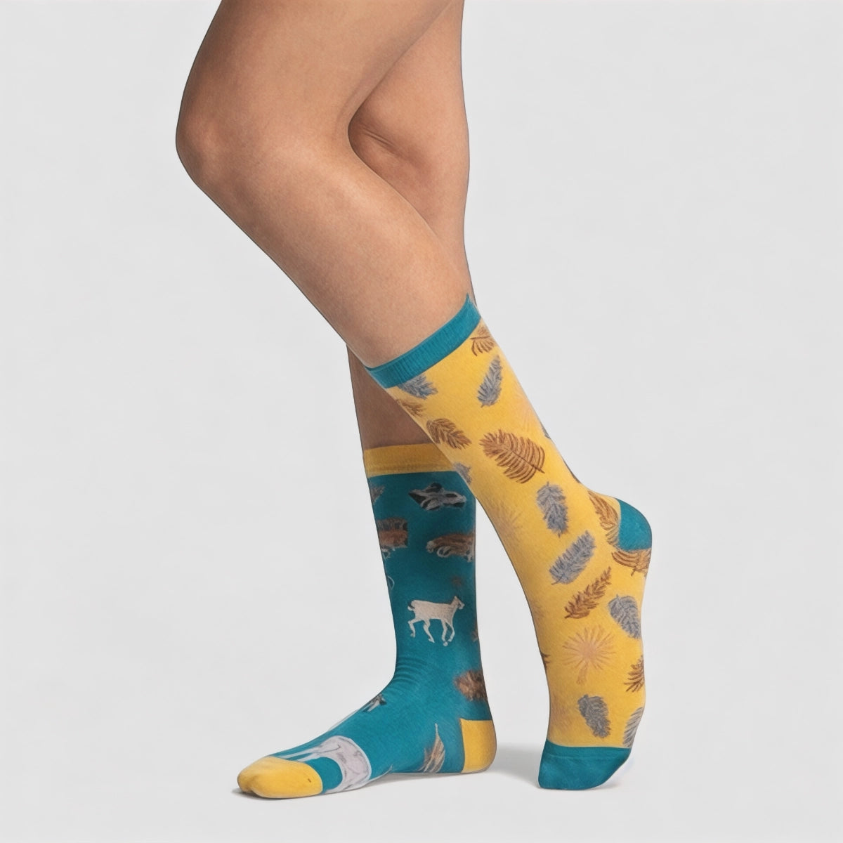 Colourful animal patterned socks on a plain background