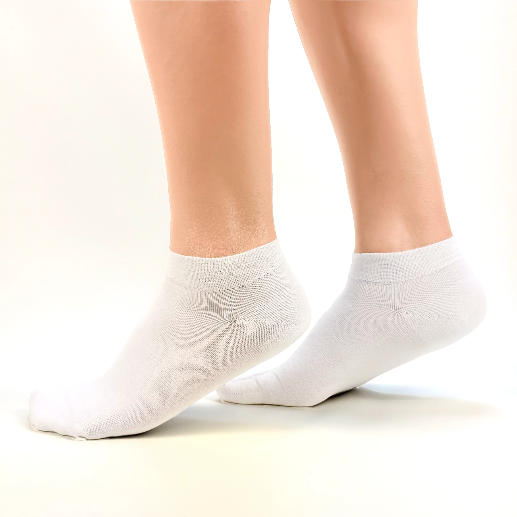 Close image of person wearing white bamboo ankle socks