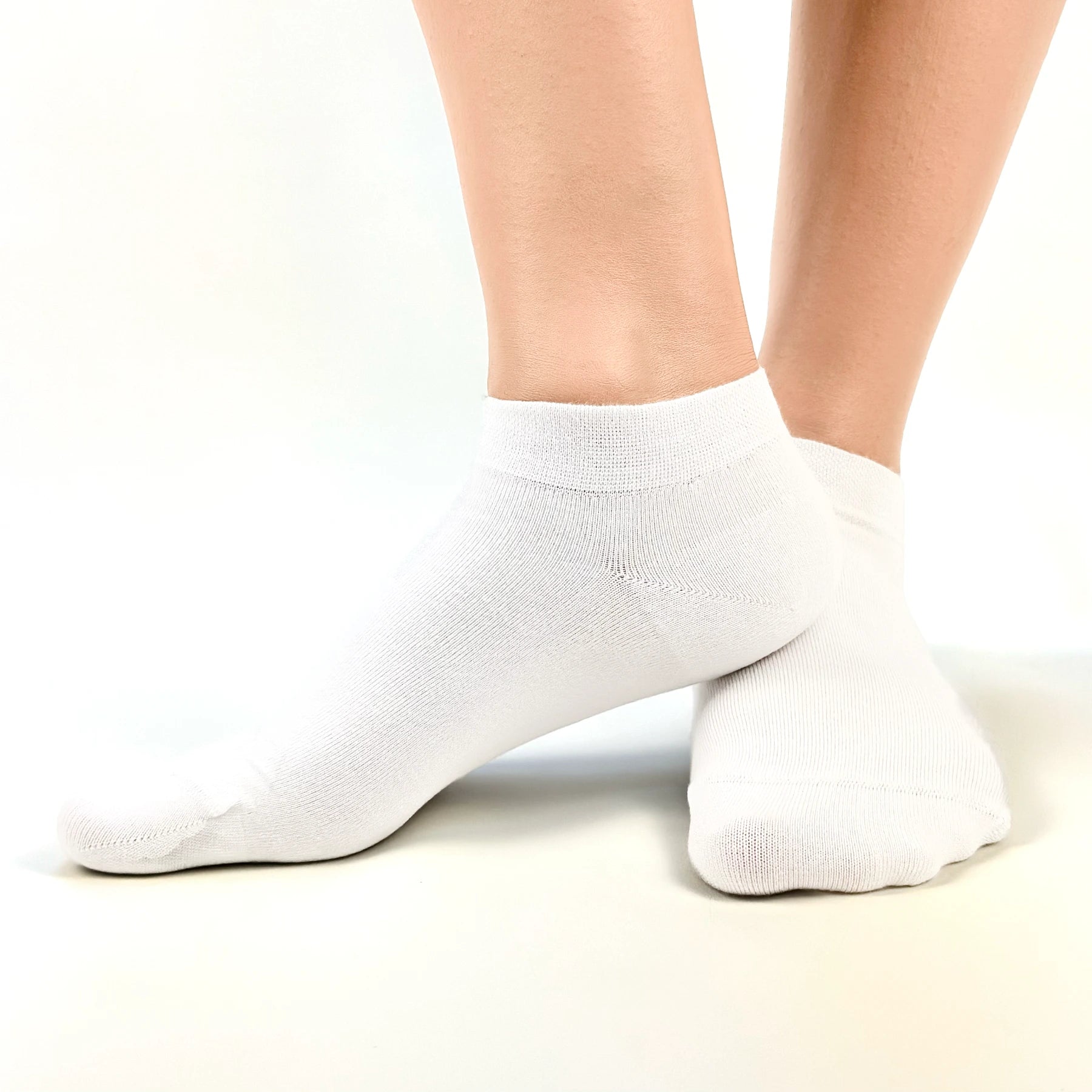 Close image of person wearing white bamboo ankle socks