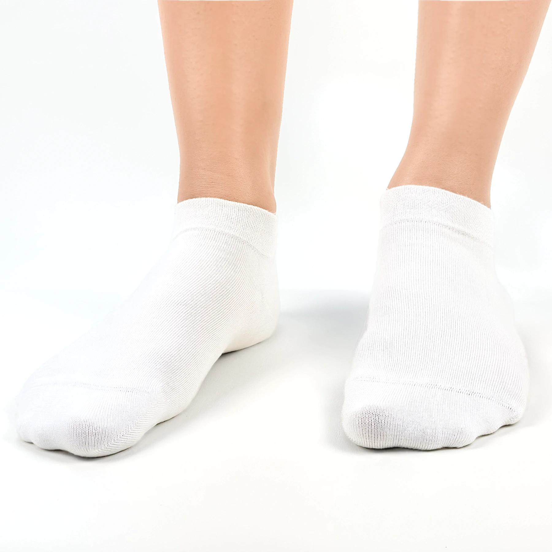 Close image of person wearing white bamboo ankle socks