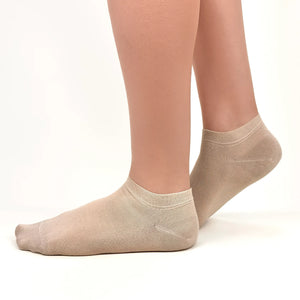 Close image of person wearing beige bamboo ankle socks