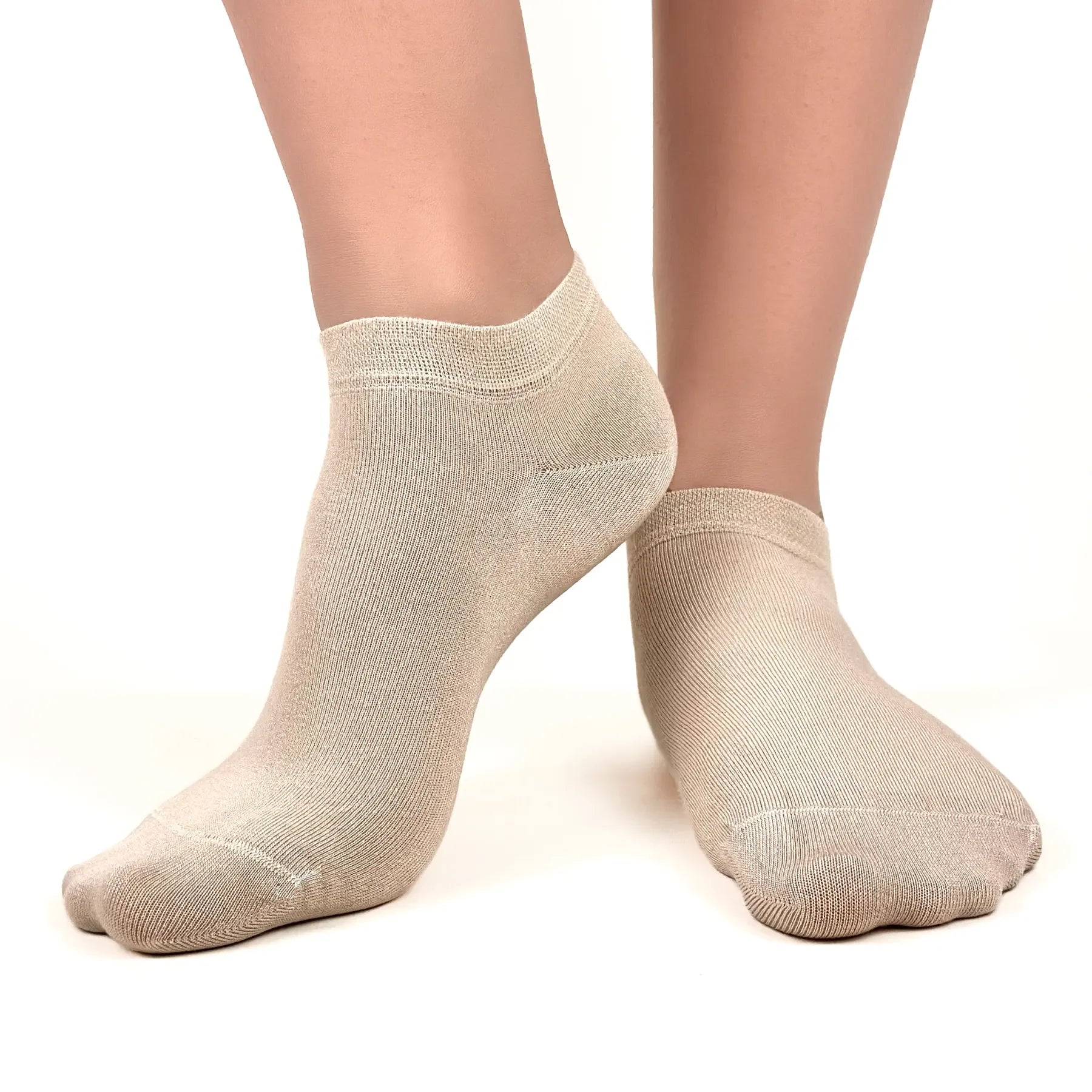 Close image of person wearing beige bamboo ankle socks