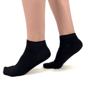 Close image of person wearing black bamboo ankle socks