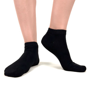 Close image of person wearing black bamboo ankle socks