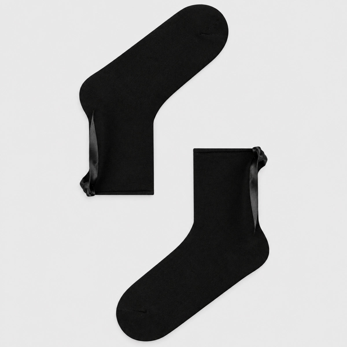 Black quarter length socks with delicate bow accent