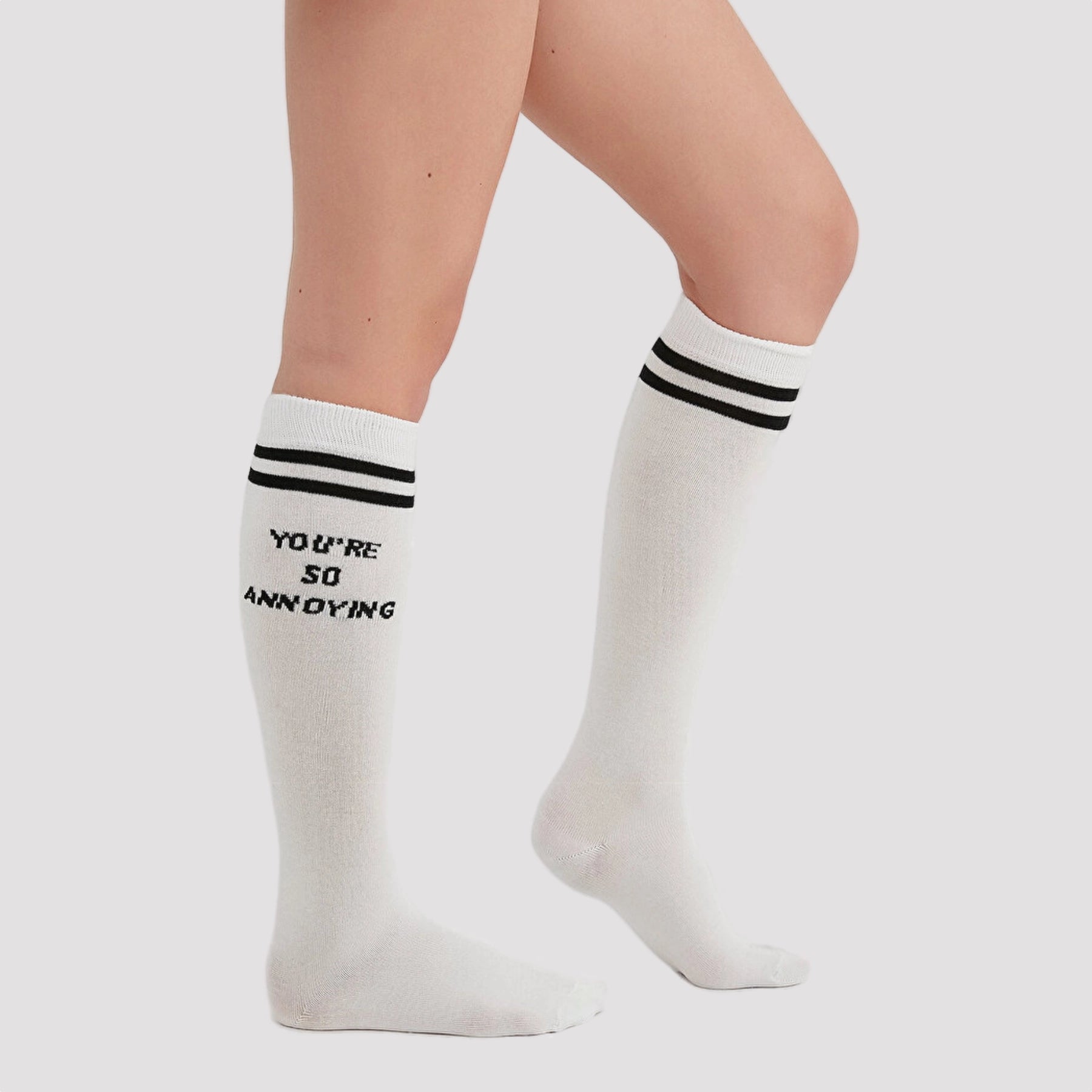 image of woman wearing knee high white sock with slogan you are so annoying