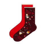set of red socks and brown socks with Christmas images and 'Happy Holidays'