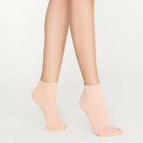 Woman wearing pink, sparkly ankle sock