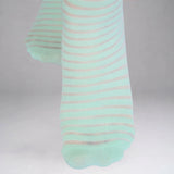 Mint socks with thin sheer stripes on a grey background