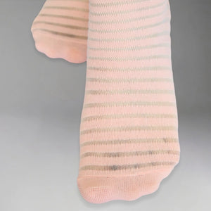Salmon socks with thin sheer stripes on a grey background
