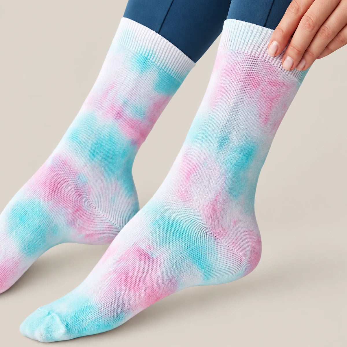 Person wearing washed blue and pink crew socks