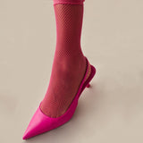 Close-up of fuchsia quarter length mesh sock with matching open shoe