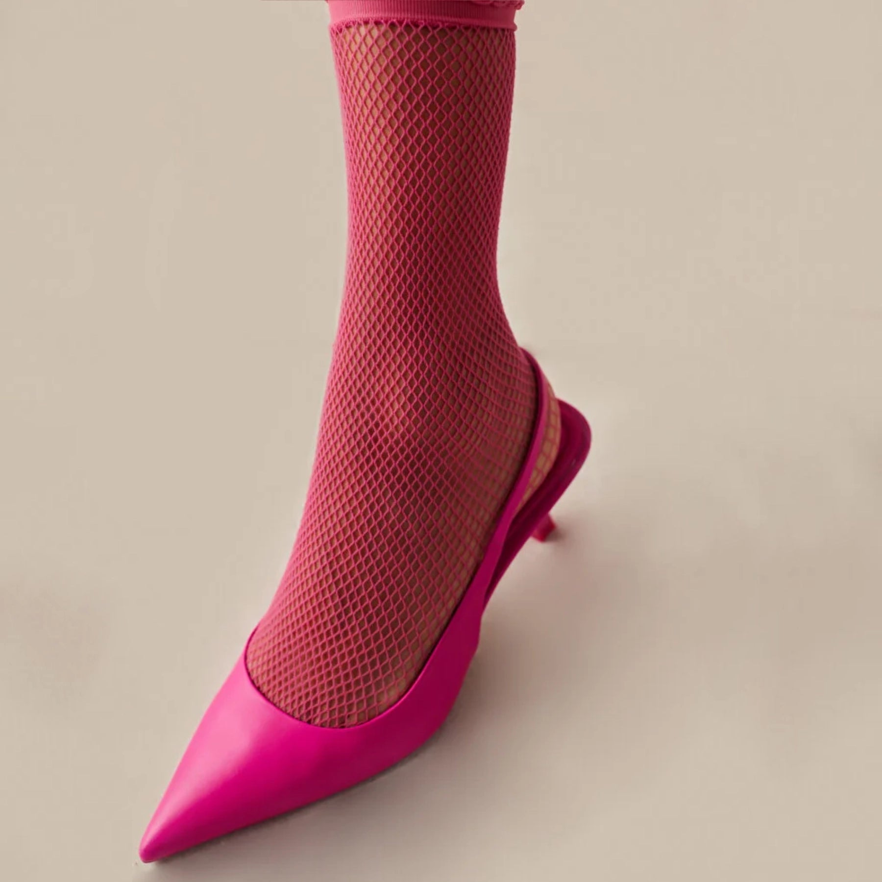 Close-up of fuchsia quarter length mesh sock with matching open shoe