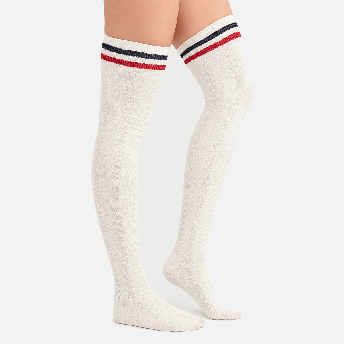 Woman wearing ivory coloured thigh-high socks with a black and a white stripe around the cuff