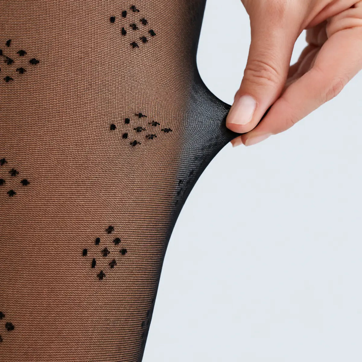 image of woman wearing black dice patterned pantyhose
