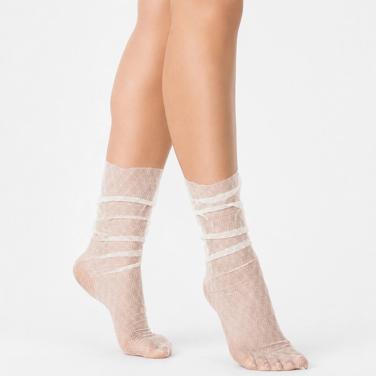 Ivory sheer designer ankle socks with delicate lace pattern styled on a female model against a light background