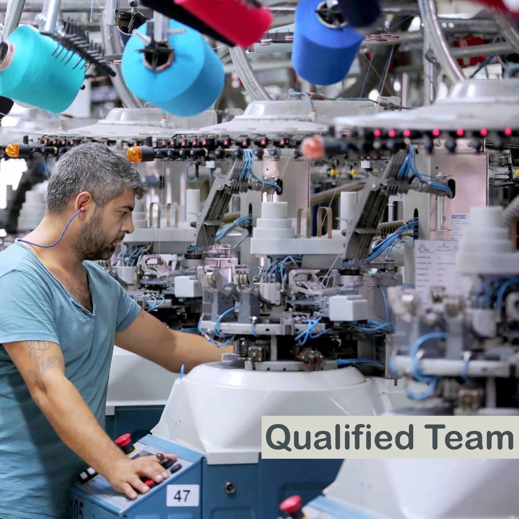 image of man overseeing sock manufacturing on the factory floor