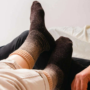 Person wearing brown Alpaca merino wool socks with a beige stripe