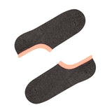 A pair of gray no-show seamless socks with a peach-colored band