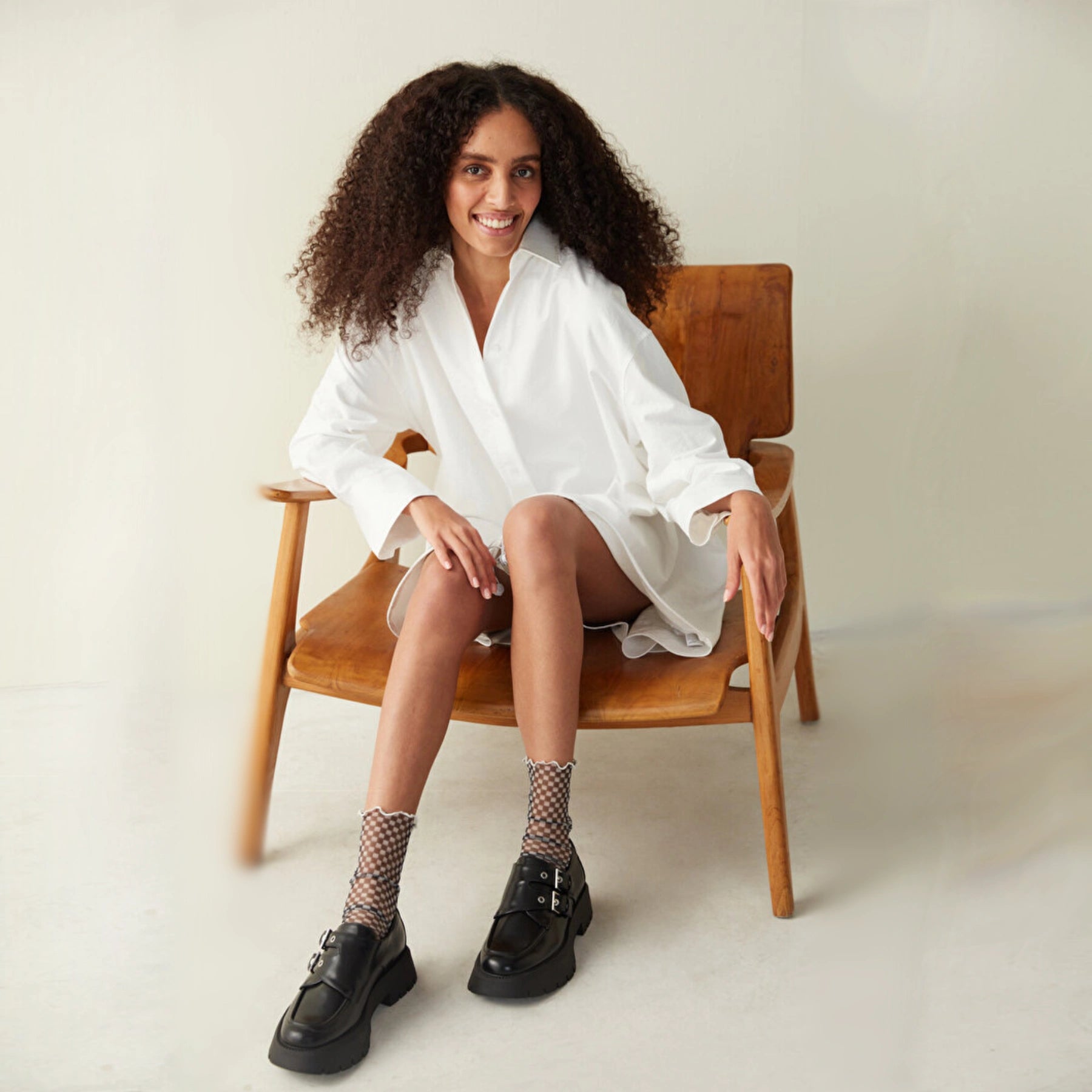 A woman wearing black and white frilled socks