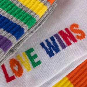 close-up photo of assorted 'love wins'-themed crew socks