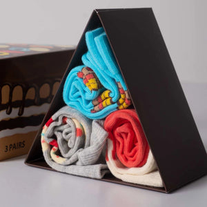 photo of 3 pairs of assorted cake-themed crew socks in gift box