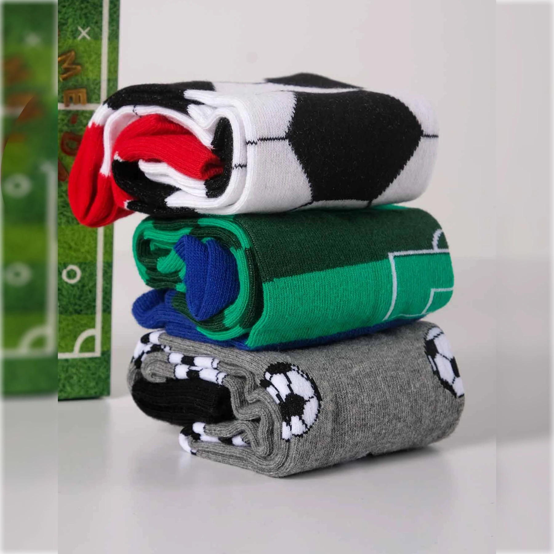 photo of 3 pair of assorted soccer-themed crew socks