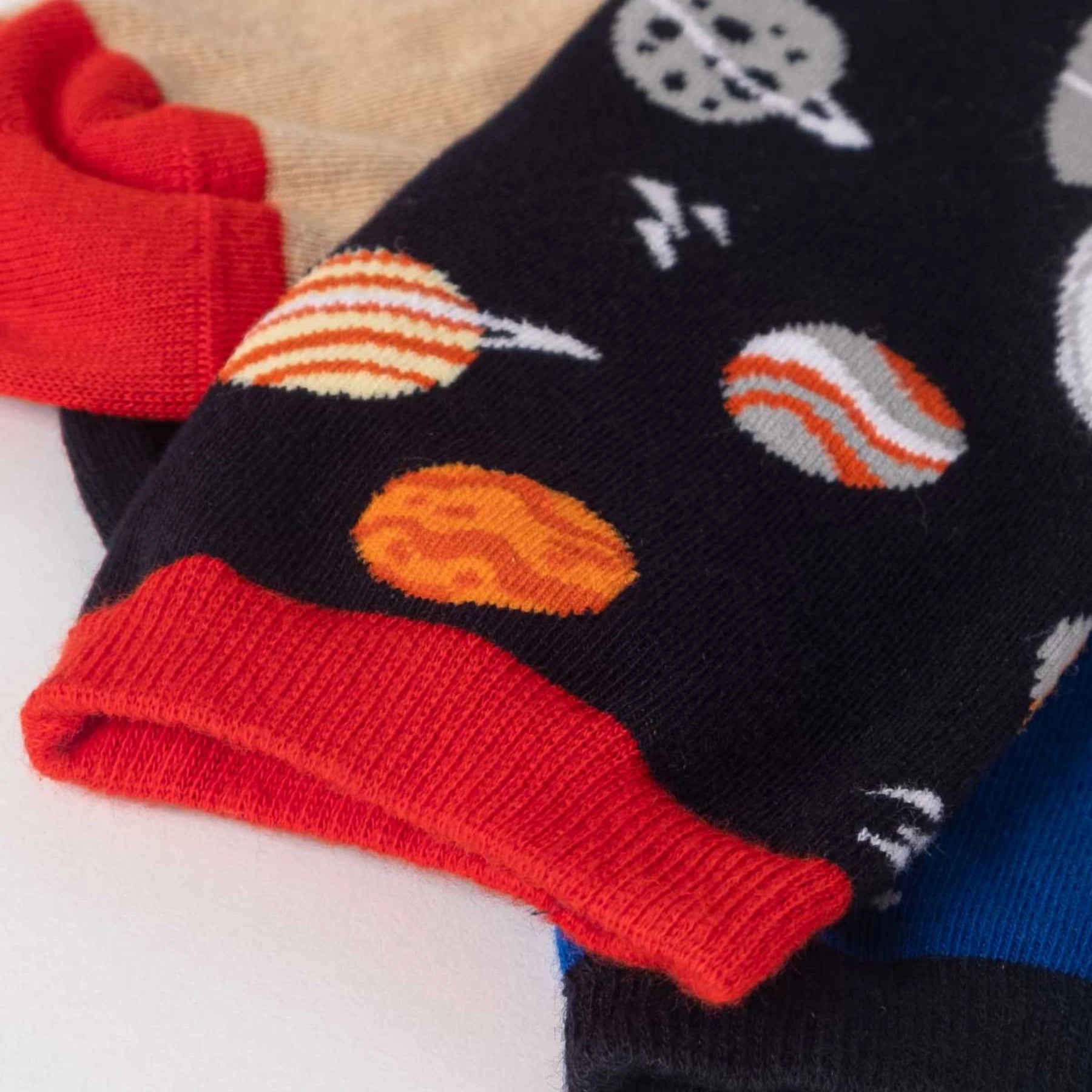 photo of mismatched space-themed crew socks