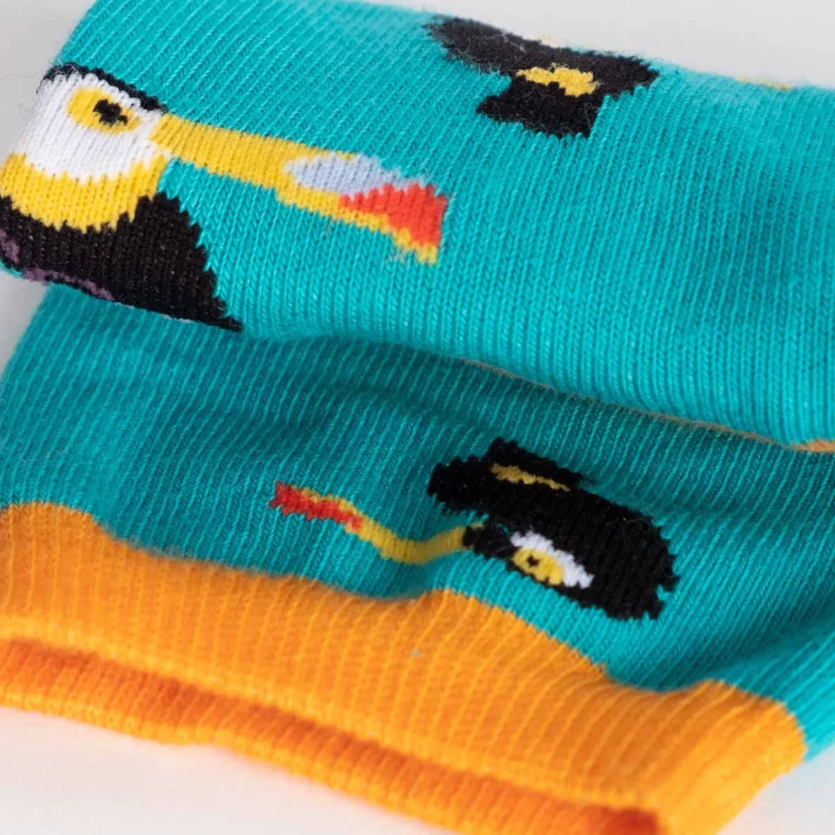 photo of turquoise crew socks with toucan images