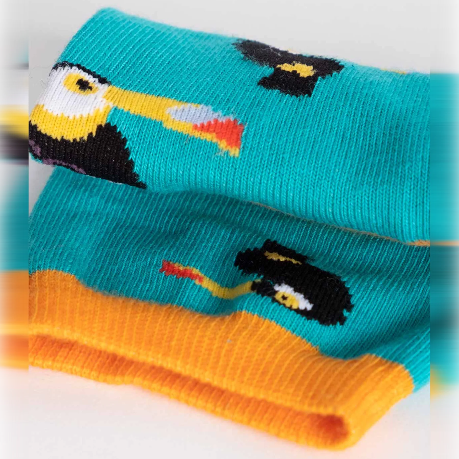 photo of turquoise crew socks with toucan images