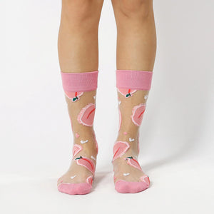 photo of woman wearing sheer, pink fruit patterned crew socks