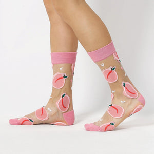 photo of woman wearing sheer, pink fruit patterned crew socks