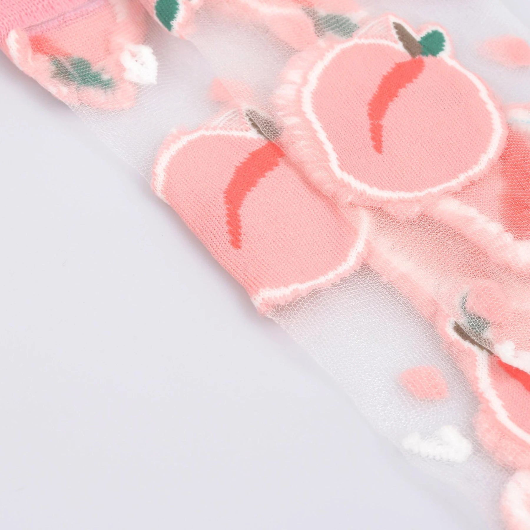 photo of sheer, pink fruit patterned crew socks