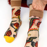 image of person wearing sheer socks with plant detail