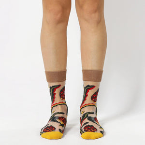 image of person wearing sheer socks with plant detail