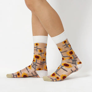 photo of woman wearing sheer, sunflower patterned crew socks