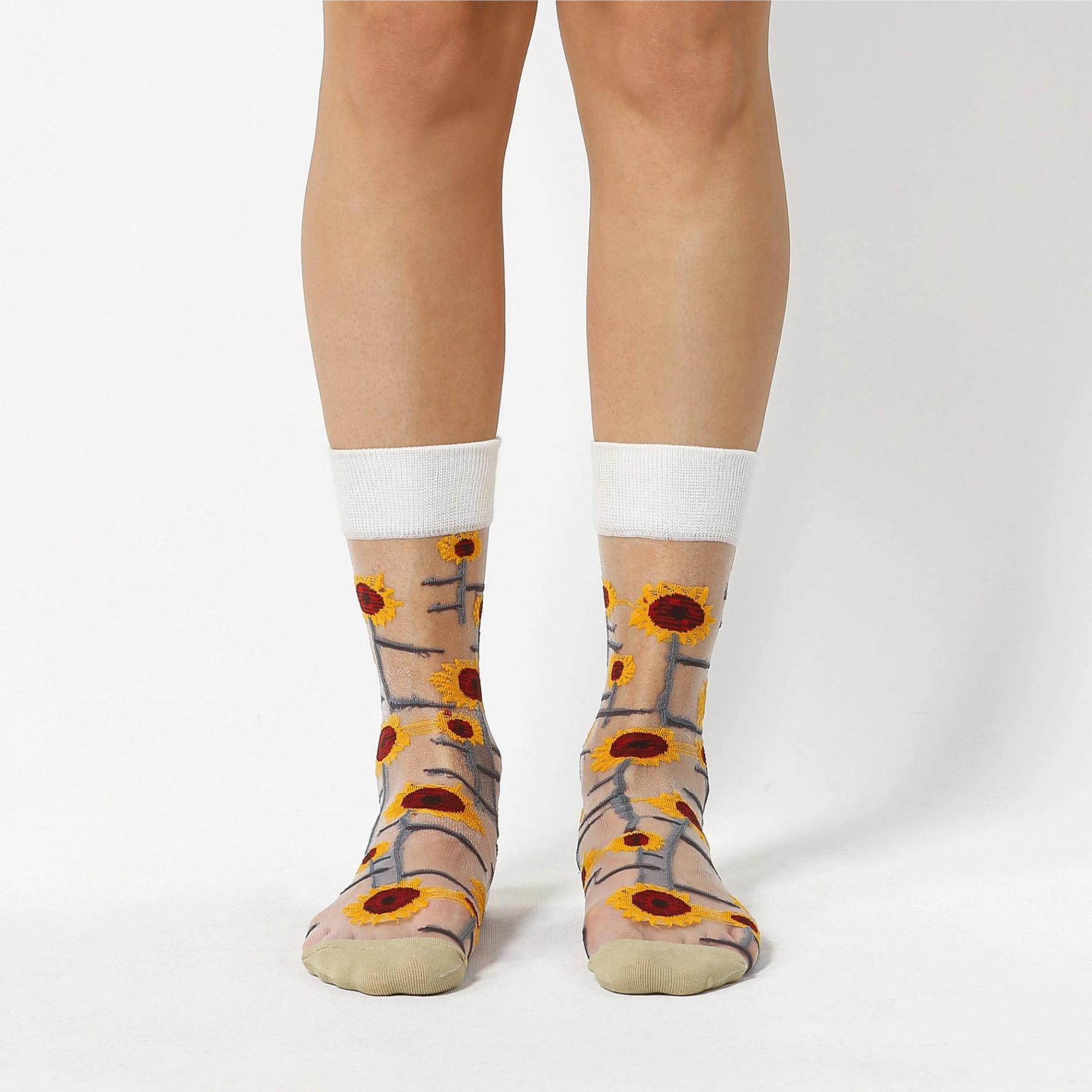 photo of woman wearing sheer, sunflower patterned crew socks