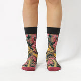 image of person wearing sheer socks with plant detail