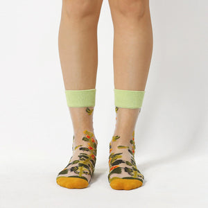 image of sheer socks with plant detail