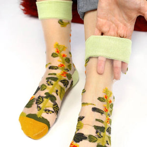 image of sheer socks with plant detail