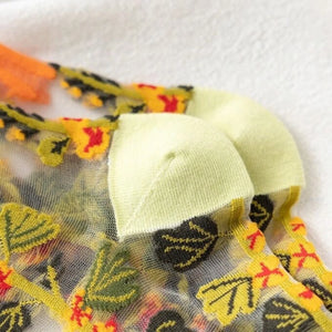 image of sheer socks with plant detail